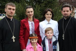 Fr. Mykola, Fr. Volodymyr, and their families in 2011.